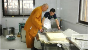 Ven. Ren Da works with temple tofu making
