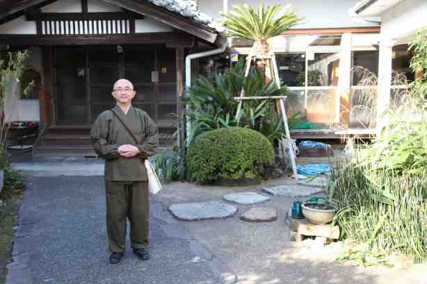 Rev. Fujio in front of Dokuon-ji Temple