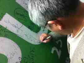 Rev. Okochi signs the guest wall at TEPU's office in Taipei